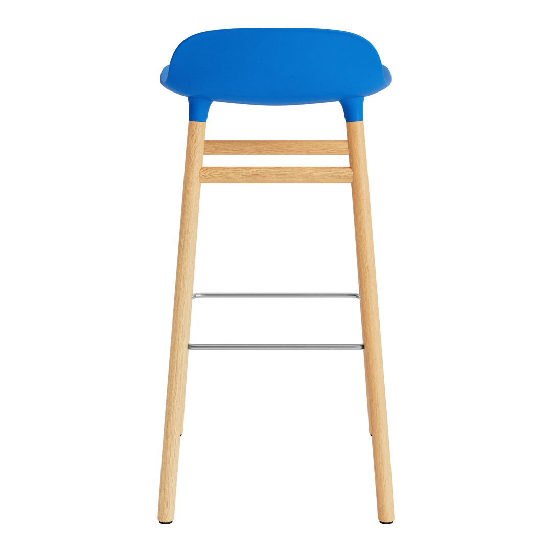 Blue seat bar stool with natural wood legs and silver footrest, featuring a sleek, modern design.