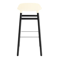 Cream top bar stool with a sleek black frame and chrome footrest, perfect for modern interiors.