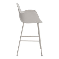 Light gray bar stool with a sleek, minimalist design and smooth curved seat, complemented by white legs.