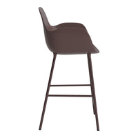 Brown modern bar stool with a smooth, curved seat and sleek metal legs. Minimalist design ideal for contemporary spaces.