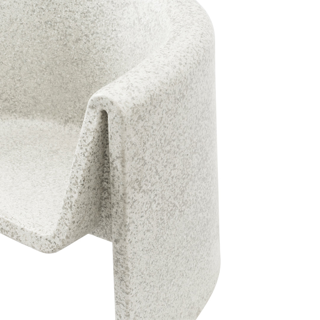 Textured light gray chair with a subtle speckled pattern, elegantly curved design for modern aesthetics.