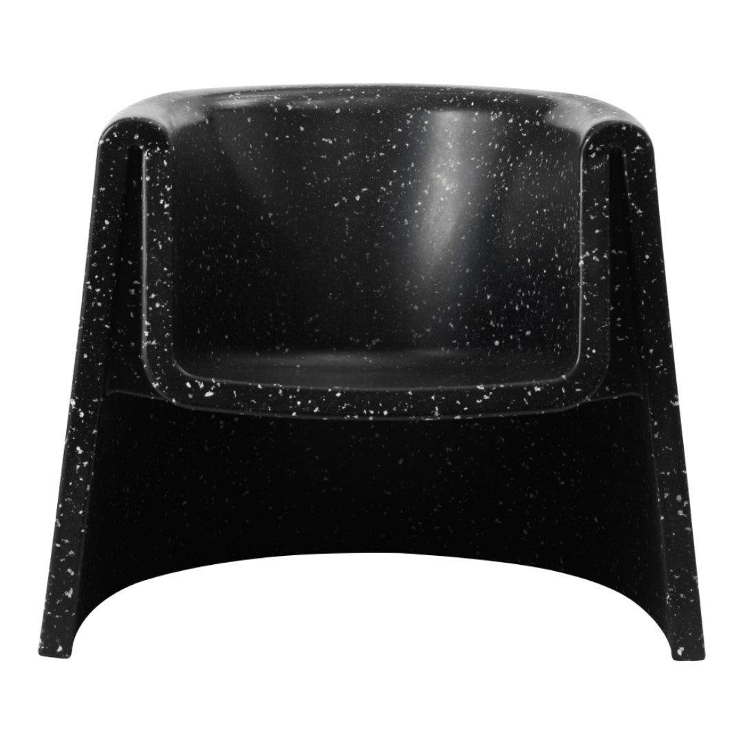 Black armchair with a speckled pattern, featuring a smooth, modern design. Perfect for contemporary interiors.