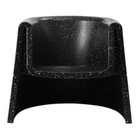 Black armchair with a speckled pattern, featuring a smooth, modern design. Perfect for contemporary interiors.