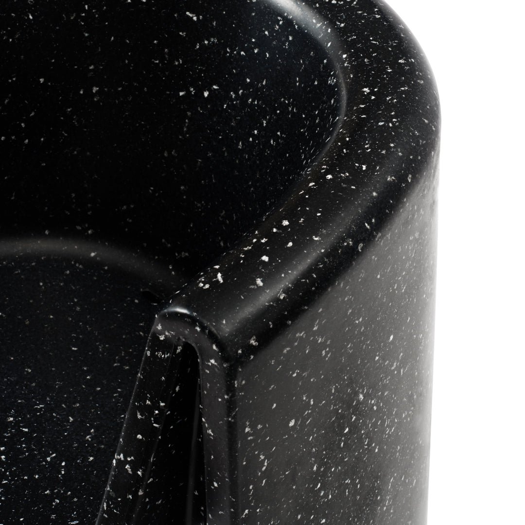 Black container with a speckled pattern, showcasing white flecks for a modern and stylish look.