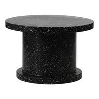 Round black table featuring a speckled pattern for a modern, minimalist look. Ideal for contemporary decor.