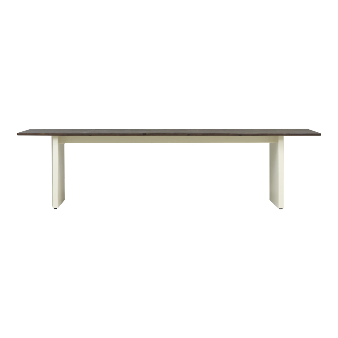 Modern table featuring a dark brown top and light cream legs, showcasing a sleek, minimalistic design.