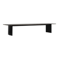 Sleek black dining table with a smooth, minimalist design and a subtle wood grain pattern on the surface.