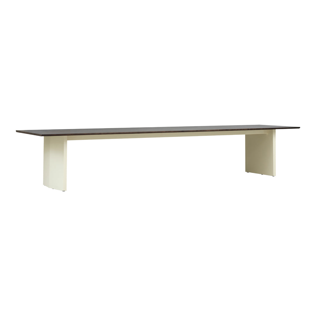 Rectangular table with a contrasting dark brown top and light beige legs, showcasing a sleek, modern design.