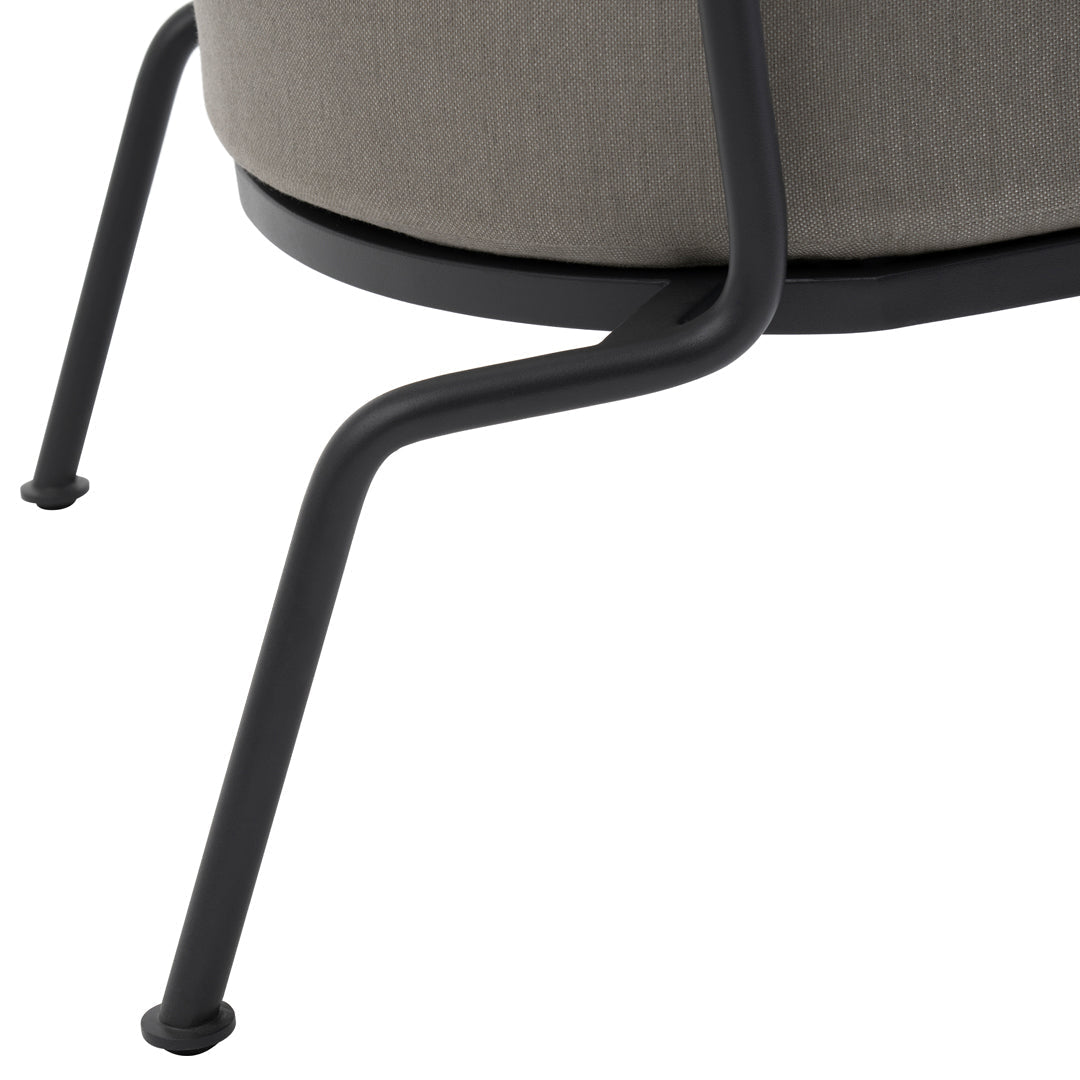 Stylish gray upholstered chair with sleek black metal legs, featuring a modern and minimalistic design.