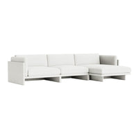 Elegant light gray sectional sofa with a minimalist design and soft, textured upholstery. Perfect for modern interiors.