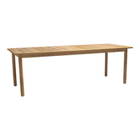 Light brown wooden dining table with a smooth, slatted surface and simple, straight legs.