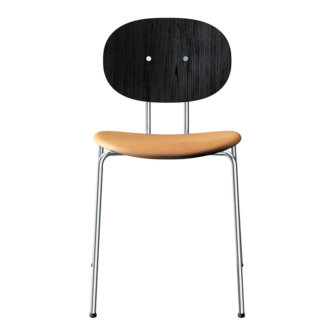 Black and wood-patterned chair with a smooth tan seat and sleek chrome legs. Stylish and modern design.