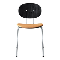 Black and wood-patterned chair with a smooth tan seat and sleek chrome legs. Stylish and modern design.