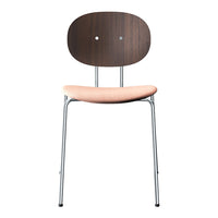 Modern chair featuring a dark wood back, soft pink cushion, and sleek silver legs, combining comfort with style.