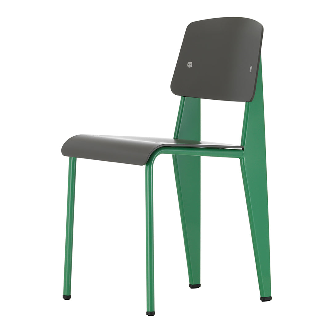 Stylish chair with a dark gray seat and backrest, featuring vibrant green legs. Modern design with sleek lines.