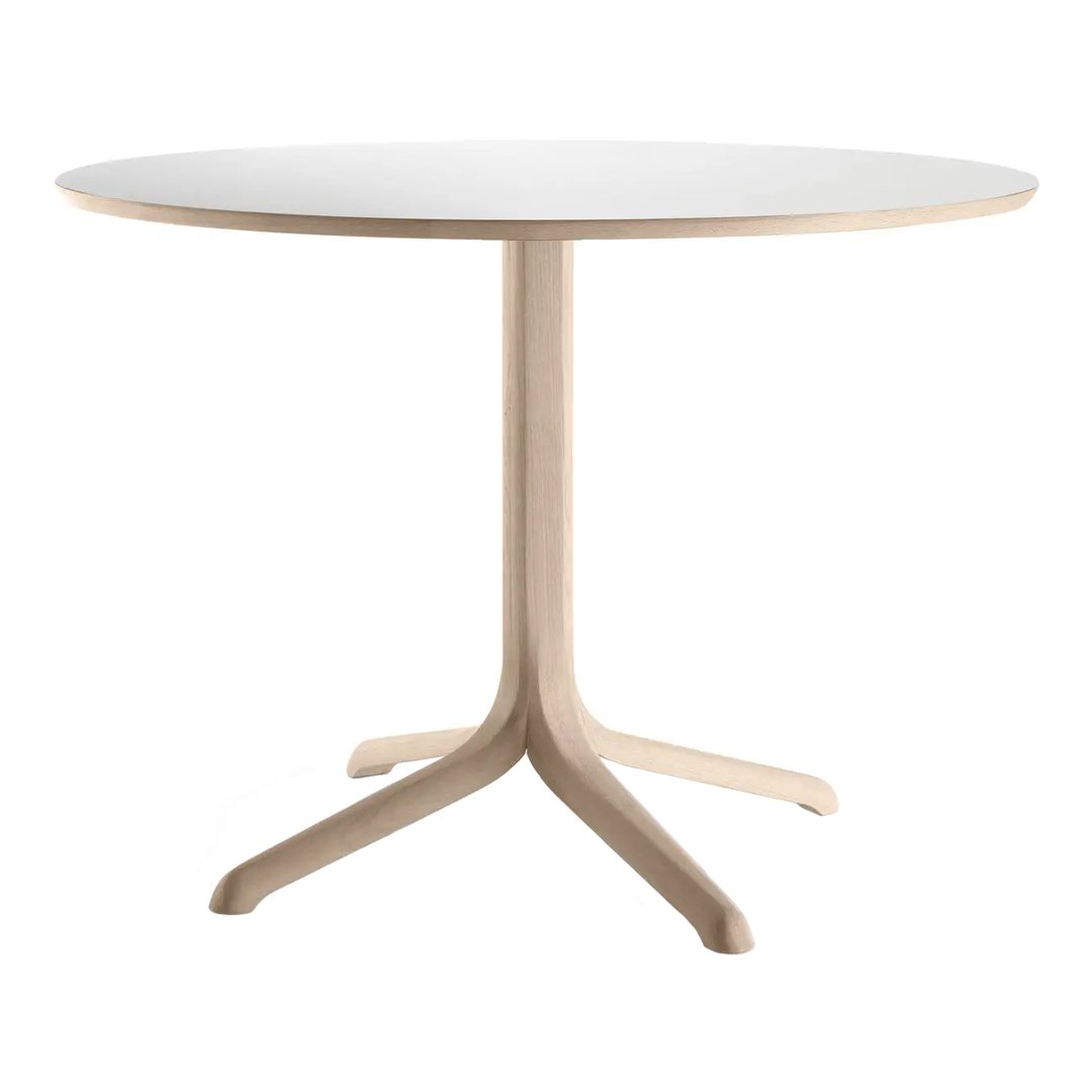 Round white tabletop with a natural wood base, featuring a sleek, minimal design and smooth, soft finish.