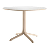 Round white tabletop with a natural wood base, featuring a sleek, minimal design and smooth, soft finish.