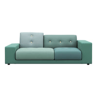 Multi-toned teal sofa with varying shades and decorative buttons for a modern touch.