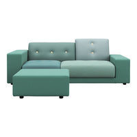 Teal and soft mint green sectional sofa with button tufting and solid colors, enhancing modern decor.