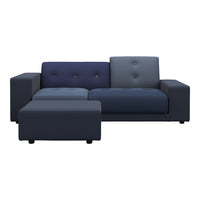 Stylish sectional sofa in deep navy and blue hues with a modern tufted design, perfect for contemporary spaces.