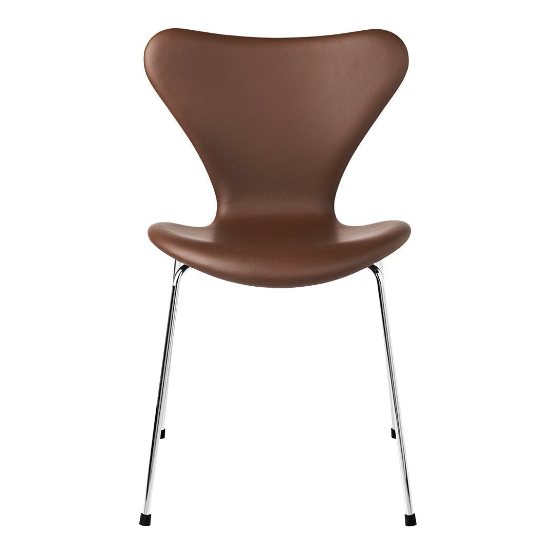 Brown curved chair with a sleek chrome base, featuring a minimalist design and smooth texture.