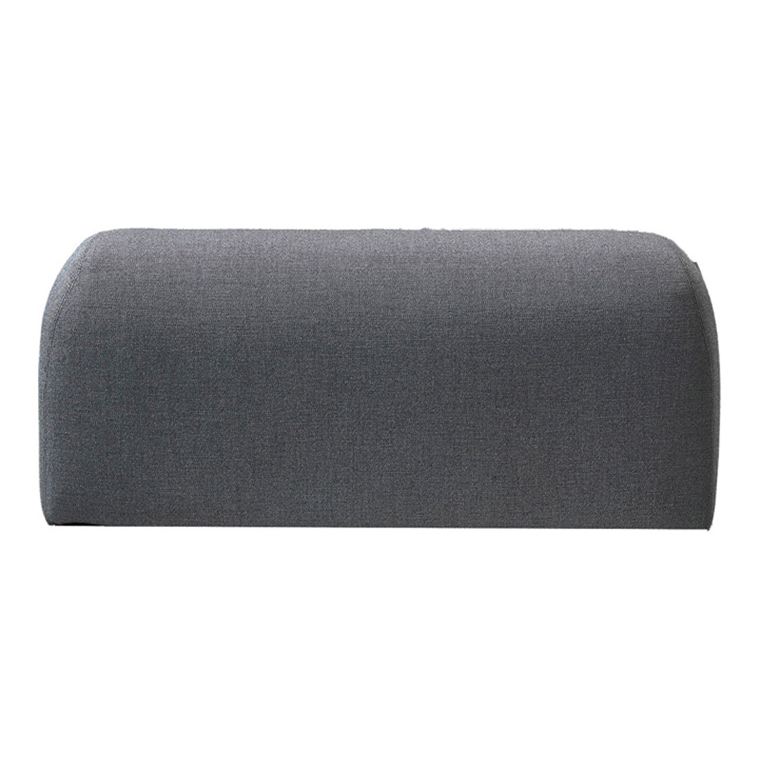 Gray upholstered bench with a smooth, curved design and subtle texture. Ideal for modern decor.