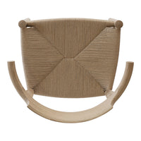 Tan woven chair with a geometric pattern, featuring rounded armrests and a minimalistic design.