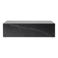 Black marble coffee table with striking white veining and a polished finish, creating a modern, elegant look.