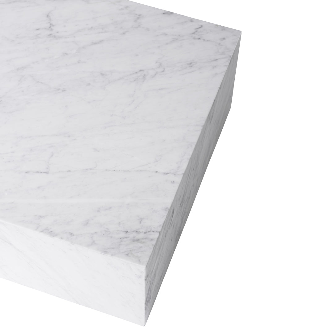 White marble slab with subtle gray veining and smooth, polished surface. Ideal for elegant home decor projects.