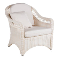 "White wicker chair with soft cream cushions, featuring a smooth, textured pattern and elegant, curved design."
