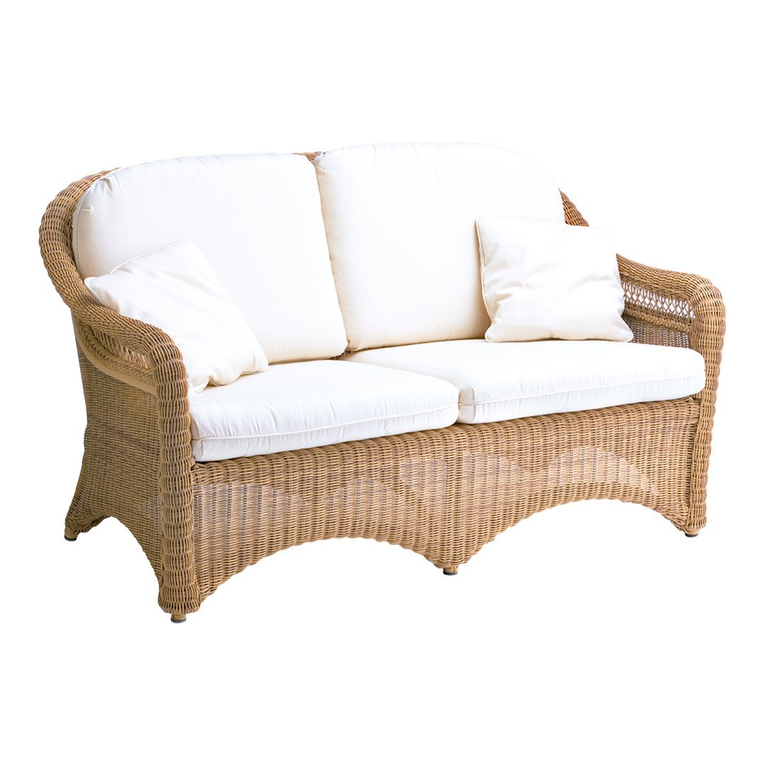 Natural wicker sofa with cream cushions, featuring a classic woven pattern for a cozy outdoor vibe.