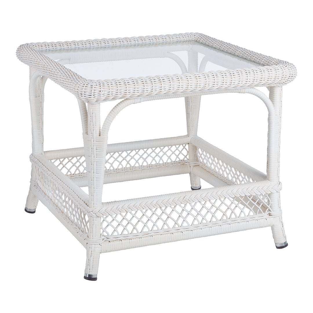 White wicker table with a glass top, featuring intricate woven patterns and a classic design. Perfect for stylish decor.