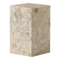 Natural marble pedestal with soft beige tones and subtle speckles, showcasing a unique textured pattern.