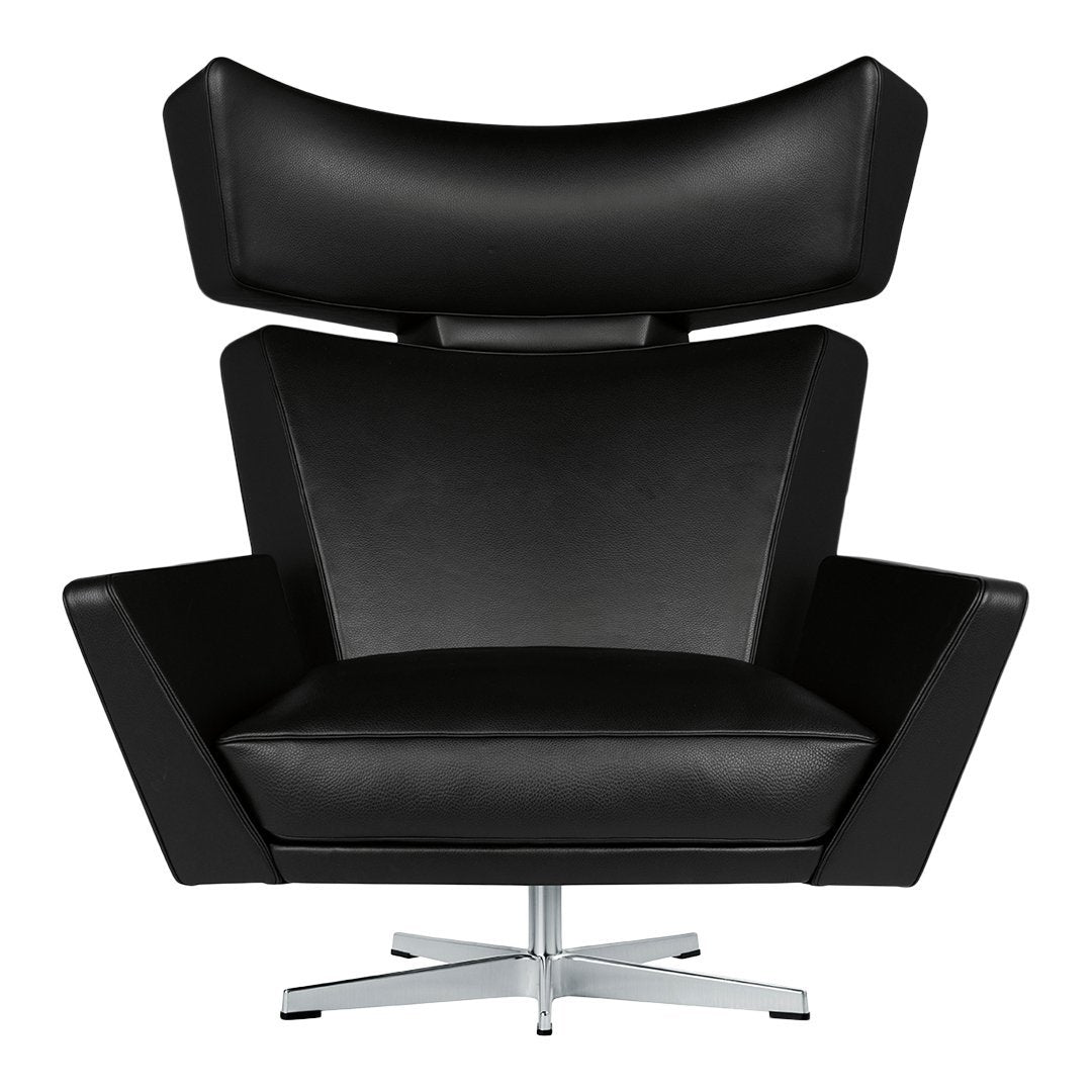 Modern black leather armchair with sleek lines and a high back design, featuring a shiny chrome base.