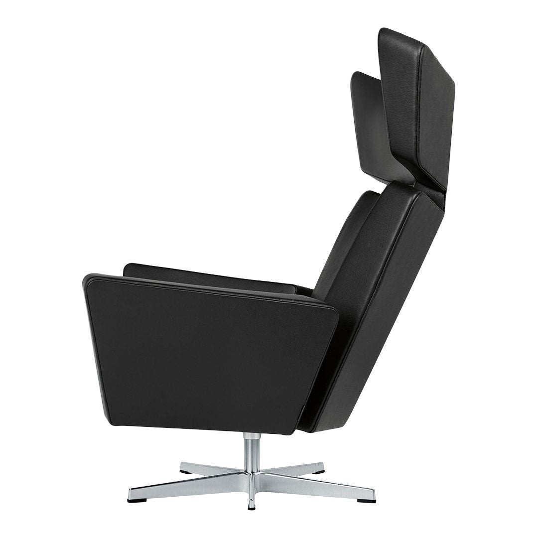 Sleek black leather recliner chair with modern design and chrome base, featuring a minimalist aesthetic.