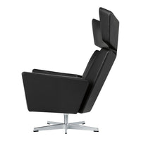 Sleek black leather recliner chair with modern design and chrome base, featuring a minimalist aesthetic.