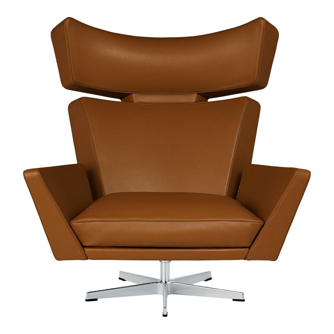 Brown leather armchair with a sleek chrome base and modern geometric design. Perfect for contemporary interiors.