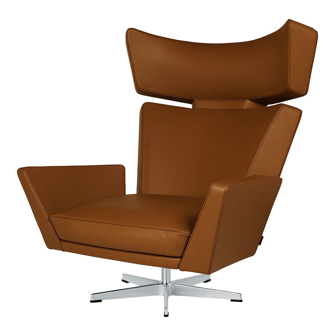 Brown leather lounge chair with a sleek, modern design and smooth, polished metal base.