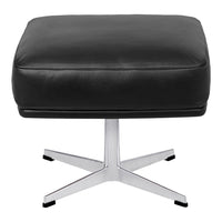 Black leather ottoman with a sleek chrome base, featuring a minimalist square design. Perfect for modern decor.