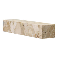 Beige stone block with natural patterns; smooth finish featuring subtle speckles and variations in color.
