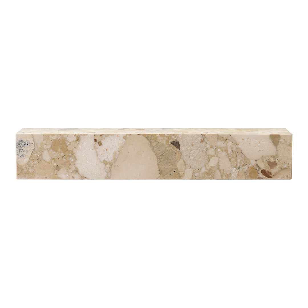 Beige stone block with light and dark speckles, showcasing a natural, earthy pattern ideal for various decor styles.