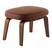 Brown leather cushion stool with natural wood legs, featuring a smooth, minimalist design. Perfect for modern interiors.