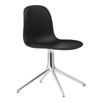 Black molded chair with a sleek chrome base, featuring a minimalist design and smooth, modern lines.