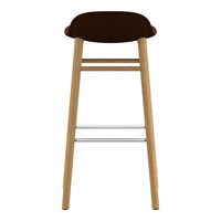 Brown cushioned seat on a natural wood frame with a silver footrest. Modern design, simple and elegant.