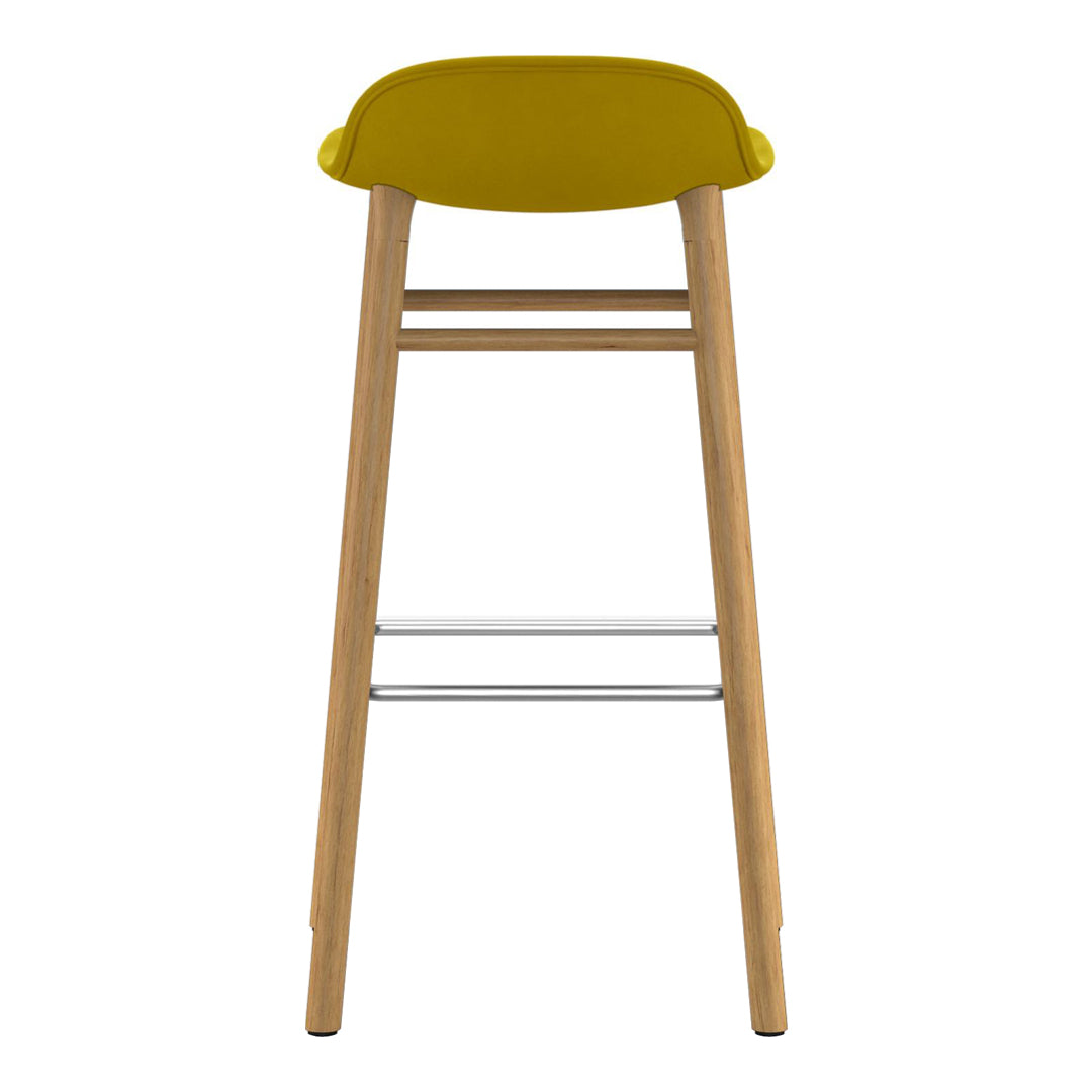 Yellow upholstered stool with wooden legs and silver footrest, featuring a sleek, modern design.