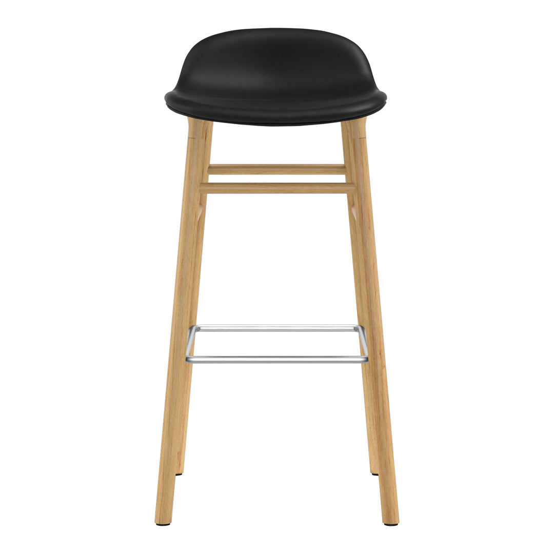 Black bar stool with a smooth finish and natural wood legs, featuring a minimalist design. Perfect for modern spaces.