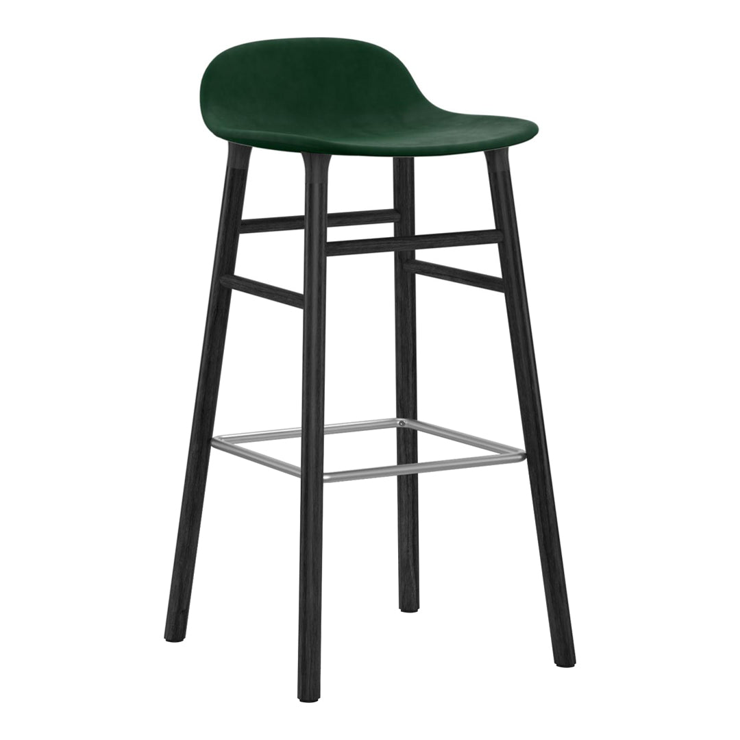 Green upholstered bar stool with a sleek black wooden frame and metal footrest. Modern and minimalist design.