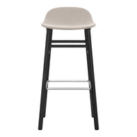 Light gray bar stool with a smooth seat and sleek black legs, featuring a minimalist design. Perfect for modern interiors.