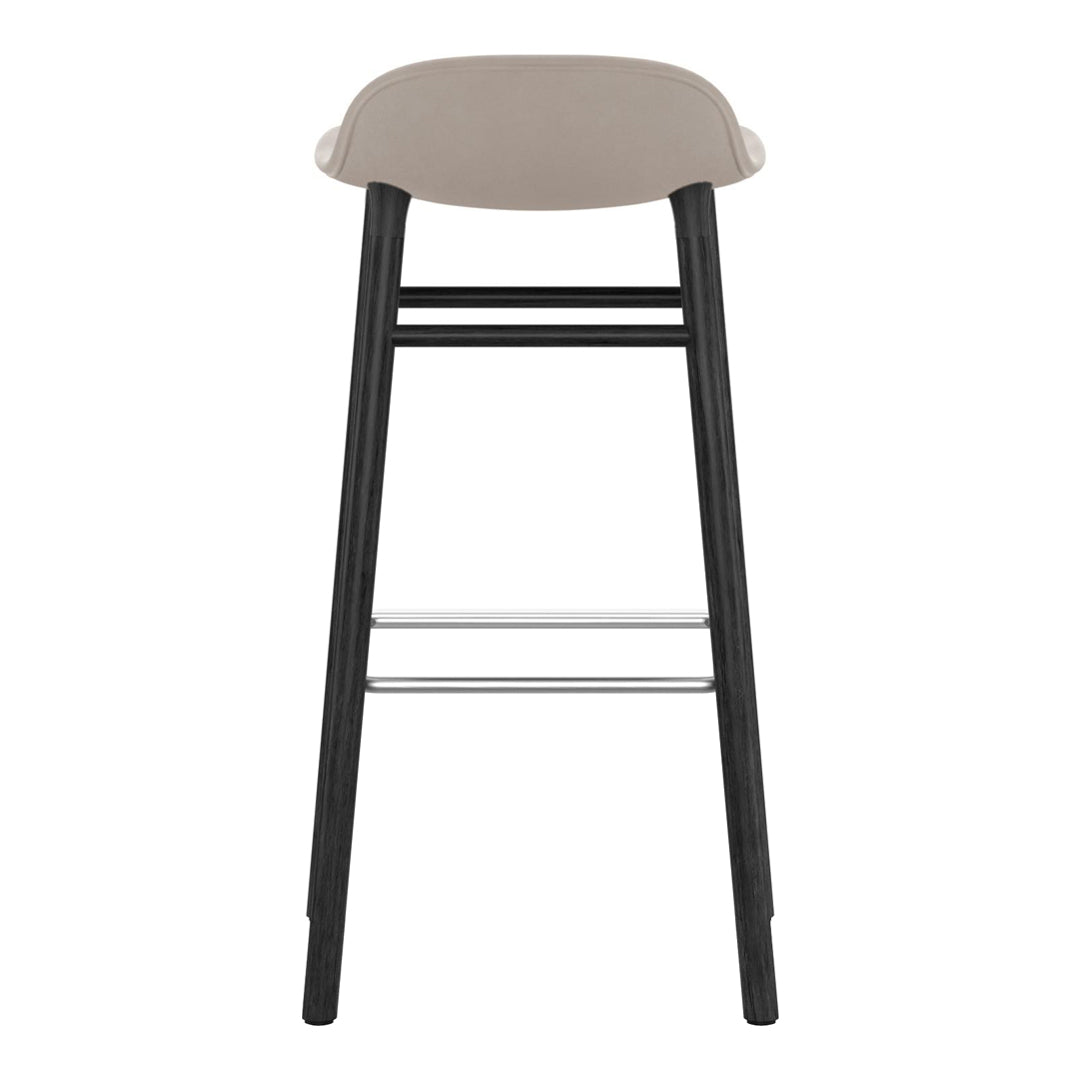 Stylish bar stool featuring a smooth beige seat and sleek black wooden legs with a silver footrest.