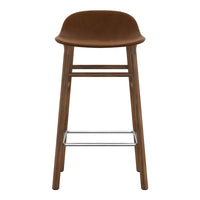 Brown upholstered bar stool with a sleek wooden frame and chrome footrest for a modern look.
